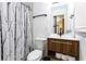 Contemporary bathroom featuring a modern vanity and stylish black and white shower curtain at 1300 Wichita Sw Dr, Atlanta, GA 30311