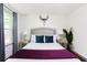 Bedroom featuring a queen size bed, side tables with lamps, and natural light from the window at 1300 Wichita Sw Dr, Atlanta, GA 30311