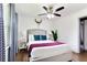 Bedroom featuring a queen size bed, side tables with lamps, and a ceiling fan at 1300 Wichita Sw Dr, Atlanta, GA 30311