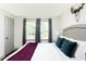Bright bedroom features natural light, modern decor, and a comfortable upholstered headboard at 1300 Wichita Sw Dr, Atlanta, GA 30311