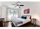 Well-lit bedroom with a comfy bed, side table, and a window providing natural light at 1300 Wichita Sw Dr, Atlanta, GA 30311
