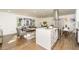 Open-concept living room and kitchen with hardwood floors, stainless steel appliances and ample natural light at 1300 Wichita Sw Dr, Atlanta, GA 30311