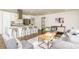 A spacious living space featuring an island kitchen, stainless steel appliances, and seating at 1300 Wichita Sw Dr, Atlanta, GA 30311
