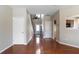 Open entryway featuring hardwood floors, an interior staircase, and natural light at 14 Old Hemlock Nw Cv, Cartersville, GA 30121