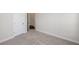 Bedroom featuring neutral carpeting, white trim, and a doorway, offering a cozy and inviting space at 167 Basil Street Dr, Cumming, GA 30040