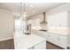 Bright kitchen featuring granite countertops, stainless steel appliances, and a large island at 167 Basil Street Dr, Cumming, GA 30040