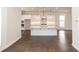 Bright kitchen featuring stainless steel appliances, white cabinetry, and an island with pendant lighting at 167 Basil Street Dr, Cumming, GA 30040