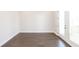Spacious living room with a glass door that provides access to a backyard deck at 167 Basil Street Dr, Cumming, GA 30040