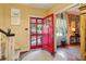 Welcoming foyer with a view of the landscaped exterior through the open red front door at 2083 Bohler Nw Rd, Atlanta, GA 30318