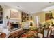 Cozy living room with a fireplace, built-in bookcases, and comfortable seating at 2083 Bohler Nw Rd, Atlanta, GA 30318