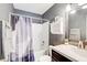 Bathroom includes a bath and shower combination, a vanity and sink, and a large mirror at 3721 Stonewall Se Cir, Atlanta, GA 30339