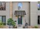 Charming home entrance with a well-kept lawn, attractive front door and covered entryway at 3721 Stonewall Se Cir, Atlanta, GA 30339
