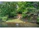Beautiful lake and lawn with lawn chairs at 3721 Stonewall Se Cir, Atlanta, GA 30339