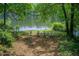 Scenic view of lake with lawn chairs at 3721 Stonewall Se Cir, Atlanta, GA 30339