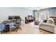 Bright living room with neutral color palette, laminate floors, and access to outdoor patio at 3721 Stonewall Se Cir, Atlanta, GA 30339