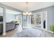 Bright and airy living room with natural light, gray sofa, and sliding glass doors to outdoor deck at 3721 Stonewall Se Cir, Atlanta, GA 30339