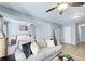 Living area with view to bedroom and hallway featuring laminate wood flooring and fan lighting at 3721 Stonewall Se Cir, Atlanta, GA 30339