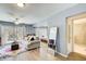 Living area with sofa, mirror, rug, and entry to bathroom and access to exterior patio at 3721 Stonewall Se Cir, Atlanta, GA 30339