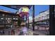 Vibrant plaza featuring shops, restaurants, and a large screen, creating an engaging urban experience at 3721 Stonewall Se Cir, Atlanta, GA 30339