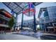 Festive plaza view with a baseball-themed display and fountain, surrounded by restaurants and shops at 3721 Stonewall Se Cir, Atlanta, GA 30339