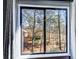 A view to the outdoors through a window on a sunny day at 3721 Stonewall Se Cir, Atlanta, GA 30339