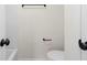 Neutral bathroom featuring black fixtures, toilet and towel rack at 2966 Knollberry Ln, Decatur, GA 30034