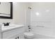 Bathroom features a white vanity, tub, and black fixtures at 2966 Knollberry Ln, Decatur, GA 30034