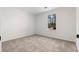 Bedroom with plush carpet and a window view at 2966 Knollberry Ln, Decatur, GA 30034
