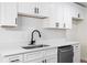 Updated kitchen showcasing white subway tile backsplash, cabinets, and stainless steel dishwasher at 2966 Knollberry Ln, Decatur, GA 30034