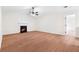 Spacious living room features beautiful laminate flooring, fireplace, and lots of natural light at 2966 Knollberry Ln, Decatur, GA 30034