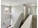 Upstairs hallway with gray carpet and bright natural light at 610 Collingsworth Ln, Lawrenceville, GA 30043