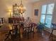 Elegant dining room with hardwood floors, decorative chandelier, and large window with shutters at 9 Ridgemere Trce Trce, Atlanta, GA 30328