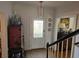 Inviting foyer with decorative accents, hardwood floors, and a view of the staircase at 9 Ridgemere Trce Trce, Atlanta, GA 30328