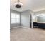 Bright bedroom featuring neutral walls, plush carpet, and modern ceiling fan at 4971 Jenny Dr, Acworth, GA 30101