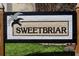 Close up of the Sweetbriar community sign with black trim and seagull accents at 4971 Jenny Dr, Acworth, GA 30101