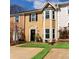 Inviting townhome featuring a well-manicured front yard and beautiful bay window at 4971 Jenny Dr, Acworth, GA 30101