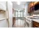 Functional kitchen with ample cabinet space and modern appliances adjacent to breakfast nook at 4971 Jenny Dr, Acworth, GA 30101