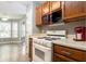 Bright kitchen featuring wood cabinets and tiled floors and a view to the breakfast nook at 4971 Jenny Dr, Acworth, GA 30101