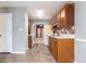 Well-lit kitchen featuring ample cabinets, tiled backsplash, and easy access to dining area at 4971 Jenny Dr, Acworth, GA 30101