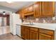 Well-equipped kitchen featuring wooden cabinets and direct access to the dining room at 4971 Jenny Dr, Acworth, GA 30101