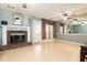 Spacious living room with a brick fireplace, modern ceiling fan, and neutral color scheme at 4971 Jenny Dr, Acworth, GA 30101