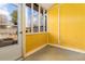 Enclosed porch with yellow walls and window at 4971 Jenny Dr, Acworth, GA 30101