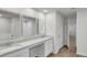 Bright bathroom with dual sinks, granite counters, and wood-look floors at 643 Egrets Lot 52 Lndg, Covington, GA 30014