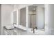 Modern bathroom with lighted mirrors, double sinks, and granite counter at 643 Egrets Lot 52 Lndg, Covington, GA 30014