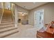 Carpeted basement featuring an open stairwell, large TV, and access to more rooms at 815 Spring View Ct, Covington, GA 30014