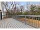 Spacious back deck features gray wood flooring and railing, perfect for outdoor entertaining at 1104 Oak Knoll Se Ter, Atlanta, GA 30315