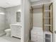 Bathroom featuring walk-in shower and modern vanity adjacent to closet area at 1104 Oak Knoll Se Ter, Atlanta, GA 30315