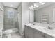 Bright bathroom with dual vanity, modern fixtures, walk-in shower and tile flooring at 1104 Oak Knoll Se Ter, Atlanta, GA 30315