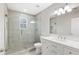 Modern bathroom with glass shower, vanity with drawers and neutral tile flooring at 1104 Oak Knoll Se Ter, Atlanta, GA 30315