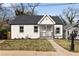 Charming bungalow with fresh white paint, black trim, and inviting front porch at 1104 Oak Knoll Se Ter, Atlanta, GA 30315